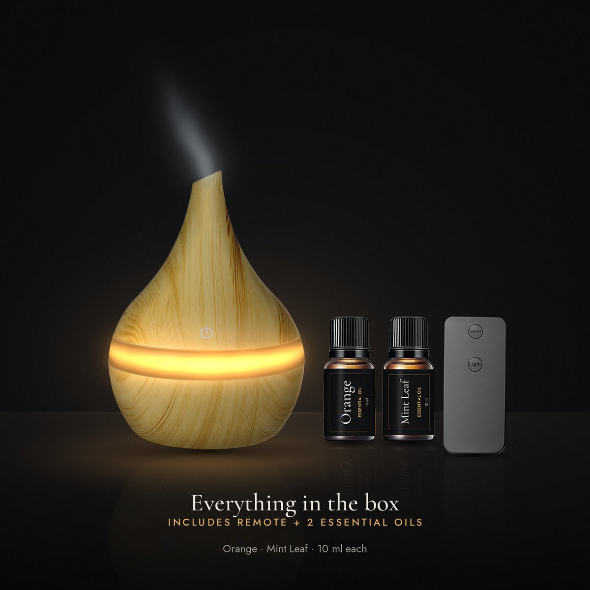 Everything in the box: LUMUNO diffuser in Birch, remote control and two 10ml essential oils, Orange and Mint Leaf
