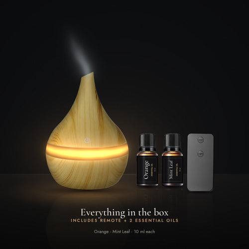 Everything in the box: LUMUNO diffuser in Birch, remote control and two 10ml essential oils, Orange and Mint Leaf