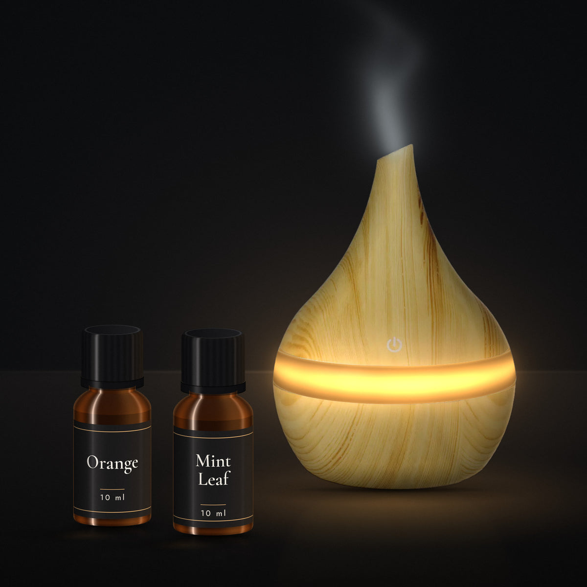 LUMUNO diffuser in Birch with its two included 10ml essential oils, Orange and Mint Leaf