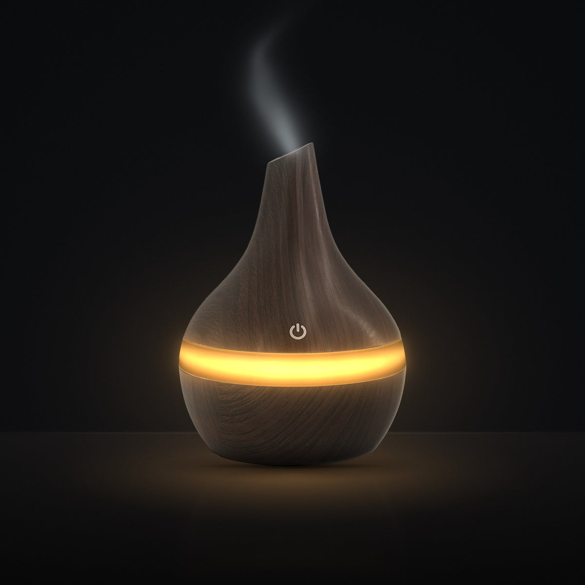 LUMUNO Aroma Diffuser in Walnut with cool mist rising and a warm amber glow