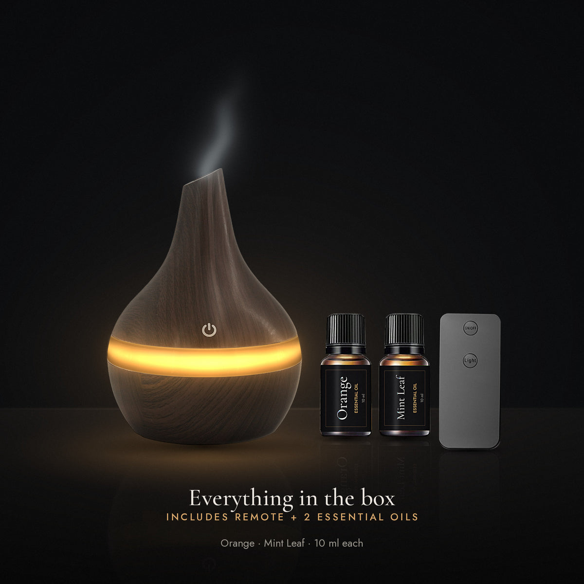 Everything in the box: LUMUNO diffuser in Walnut, remote control and two 10ml essential oils, Orange and Mint Leaf